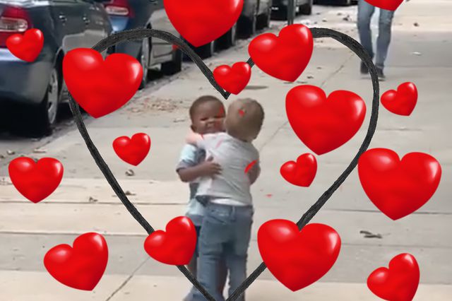 Adorable toddlers hug surrounded by hearts